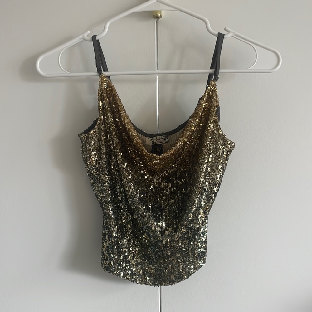 Shiny hambre gold Free People tank top in size XS.